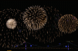 colorful fireworks display over bridge