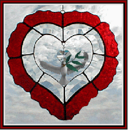 stained glass heart with flying dove